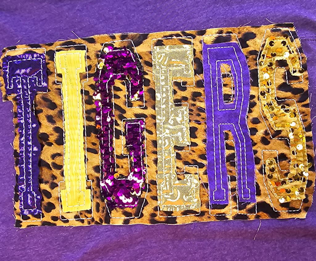 "TIGERS" UNIQUE SEQUIN DOUBLE STACKED LETTERED HEATHERED PURPLE FOOTBALL T-SHIRT | Small - 3X | Charlotte's Classy Closet