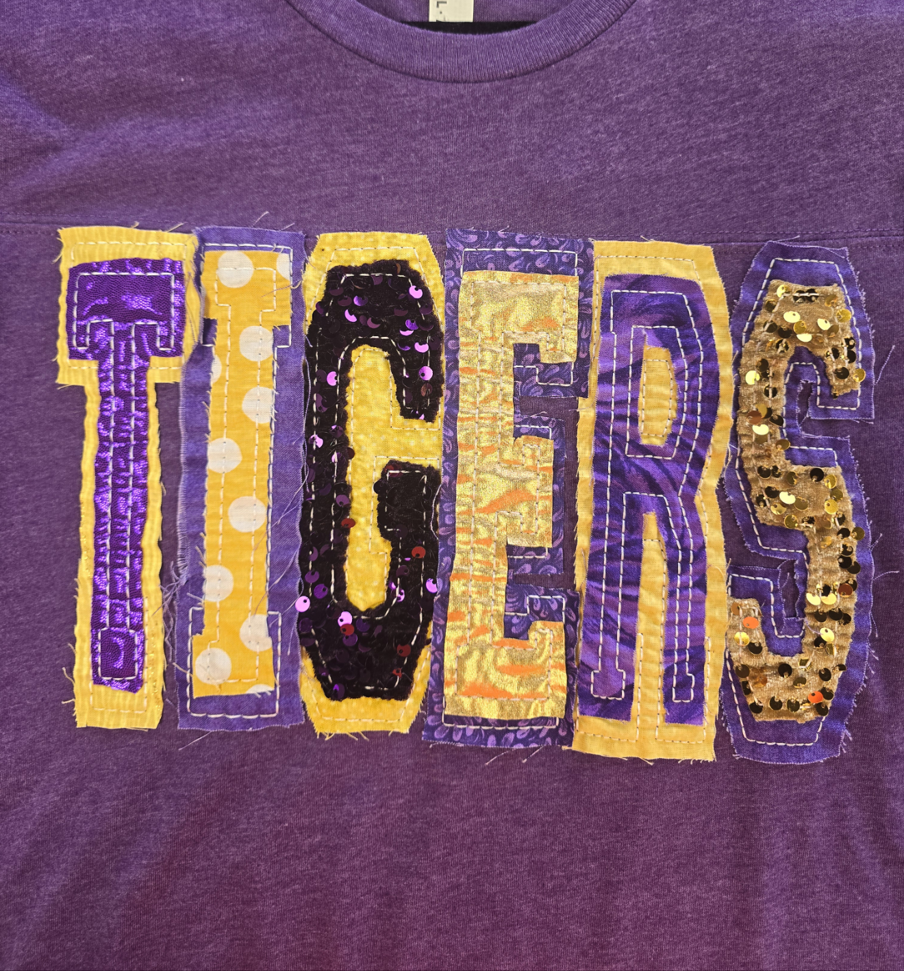 "TIGERS" UNIQUE SEQUIN DOUBLE STACKED LETTERED HEATHERED PURPLE FOOTBALL T-SHIRT | Small - 3X | Charlotte's Classy Closet